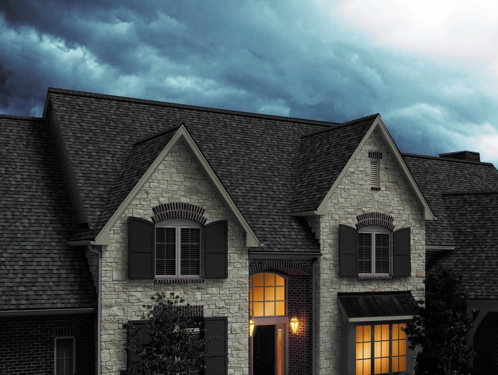 Modern home with storm approaching in background