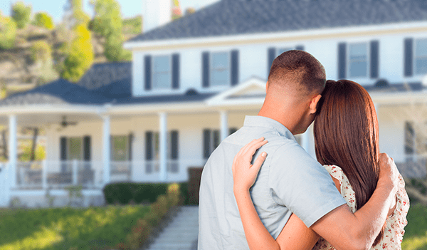 couple happy with their new roof