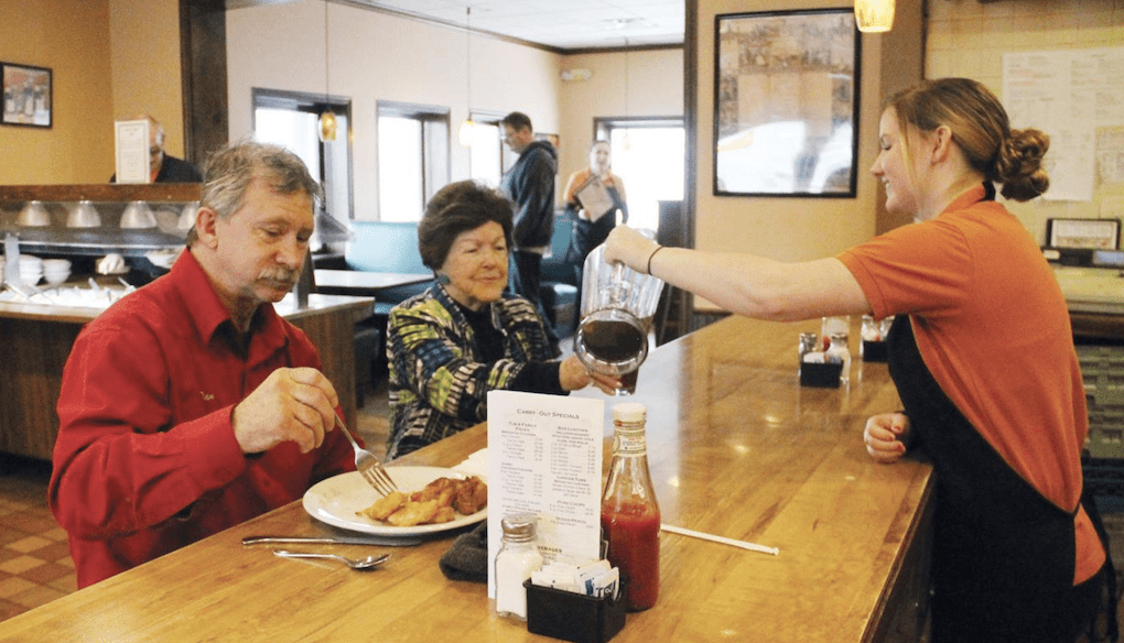 server pouring coffee to elderly couple at bar; circleville ohio restaurants