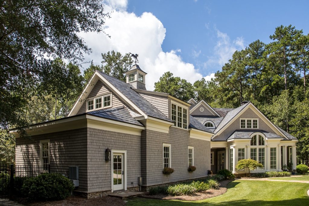 large grey home with dark gray roof color combinations