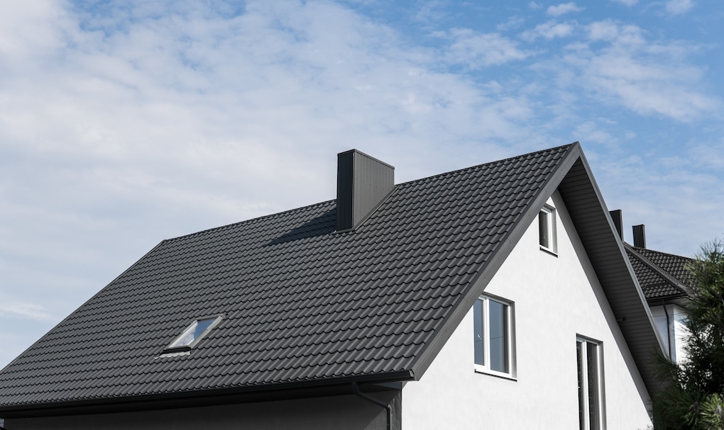 modern metal roofs vs. shingles on a white house