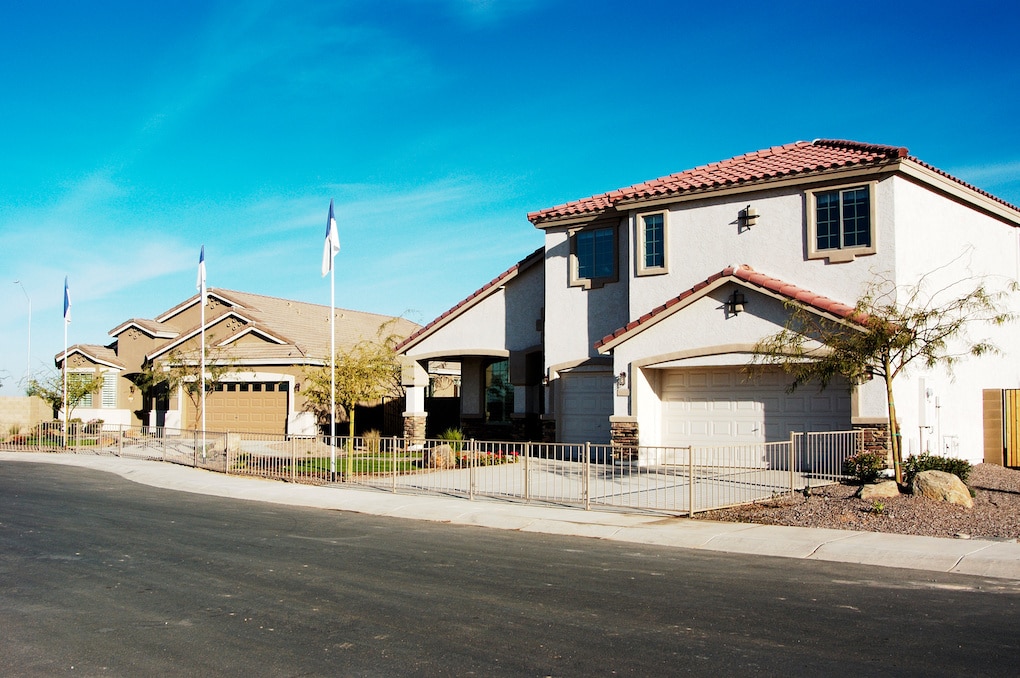 Model homes in a new subdivision in an Arizona suburb with warm toned roof shingle colors