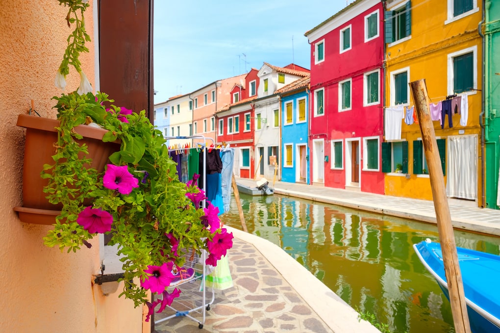 Traditional brightly painted houses and canals on the italian island of Burano near Venice