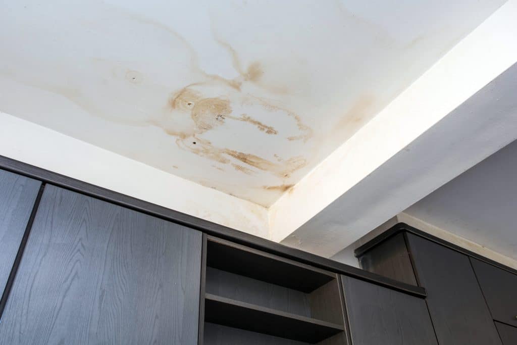 when learning how to find a roof leak, look for water stains on the ceiling like the one pictured here