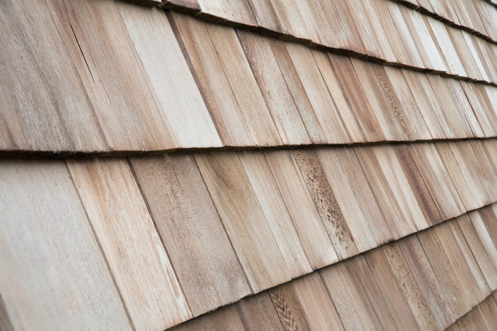 close up of wooden cedar shakes, one of the most popular roof replacement options