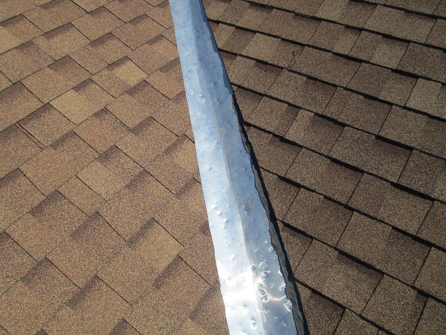 what does hail damage look like on a roof dents