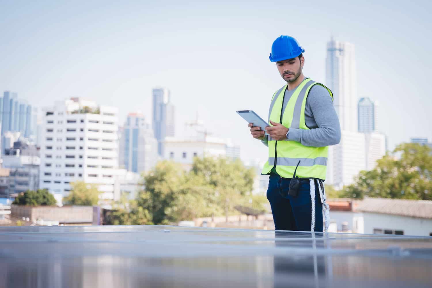commercial roof inspection hi vis vest with ipad