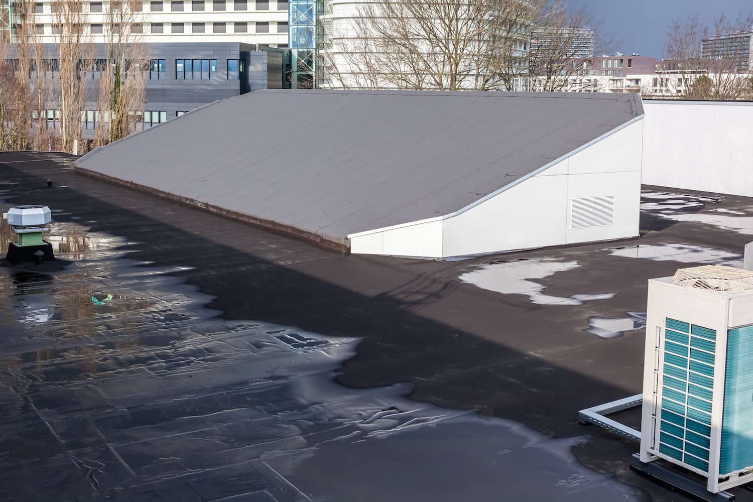 how to fix a flat roof leak pooling water