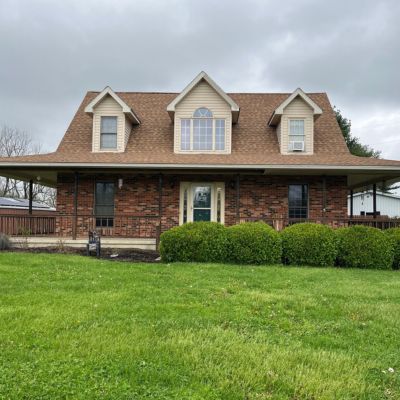 gouge Brick home with new Mansard Roof By Gouge Quality Roofing