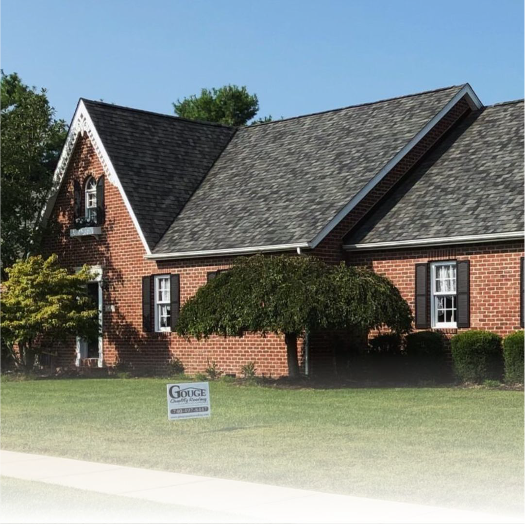 Brick home with new charcoal colored roof